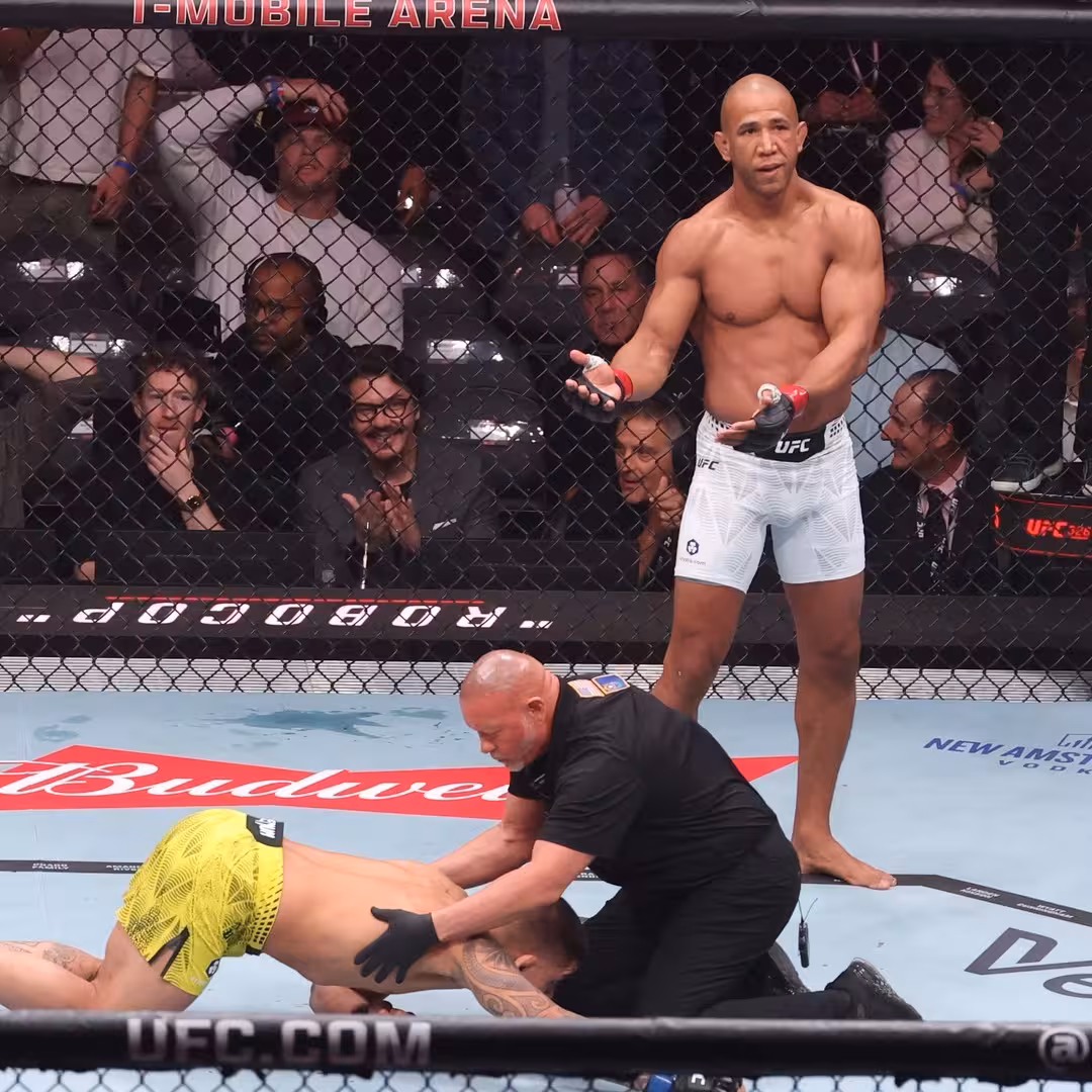 Gregory Rodrigues celebrates TKO victory over Brunno Ferreira as referee stops the middleweight fight at UFC 326