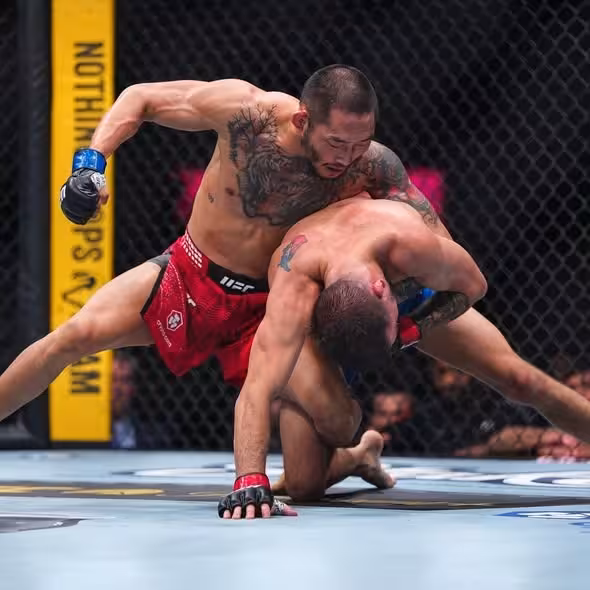 Nyamjargal Tumendemberel sprawls heavily to defend a takedown attempt from Cody Durden during their flyweight matchup at UFC 326